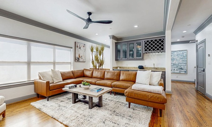 Oak Lawn Condo | Modern Dallas home with spacious living room, kitchen & big patio with city view