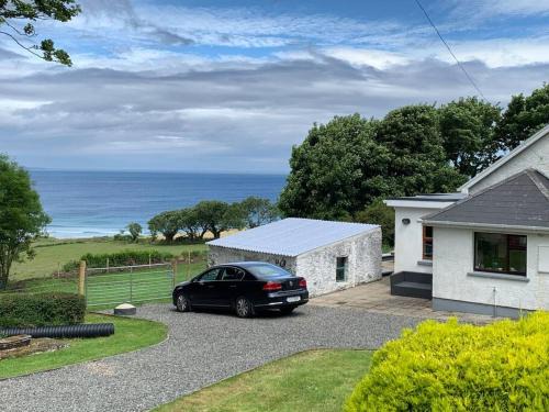 Culdaff House | Glebe Cottage…cosy cottage, sea views & parking.